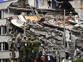 Rescuers search for survivors amid the rubble from a building flattened by the 7.1-magnitude quake the day before, in Mexico City, on September 20, 2019.   Rescuers frantically searched Wednesday for survivors of a powerful earthquake that killed more than 200 people in Mexico on the anniversary of another massive quake that left thousands dead and still haunts the country. / AFP PHOTO / RONALDO SCHEMIDTRONALDO SCHEMIDT/AFP/Getty Images