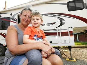 Leslie Muza with her grandson, Spencer Stone who were forced to flee their acreage near Waterton last night as fire advanced are now staying at the Pincher Creek Veteran's Campground on Tuesday September 12, 2017.