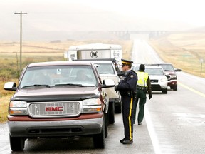 RCMP man the road block at Highway 6 and 505.