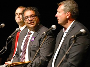 Naheed Nenshi debates arts and culture with Bill Smith, right, on Aug. 28. Mayoral candidate David Lapp is on the left.