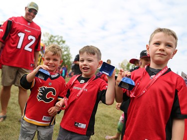 Stamps fans Coen, Caleb and Ben warm up their cow bells before the start of the Labour Day Classic at McMahon Stadium on Monday September 4, 2017. Gavin Young/Postmedia