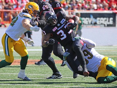 Calgary Stampeders running back Jerome Messam runs the all against the Edmonton Eskimos during the first half of the Labour Day Classic at McMahon Stadium, Monday September 4, 2017. Gavin Young/Postmedia
