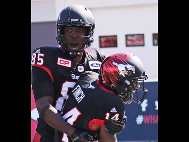 Calgary Stampeders running back Roy Finch is congratulated by Julan Lynch after running an Edmonton Eskimos kick return in for a touch down during the first half of the Labour Day Classic at McMahon Stadium, Monday September 4, 2017. Gavin Young/Postmedia