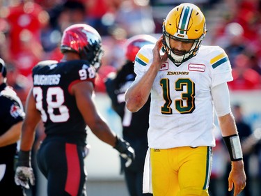 Edmonton Eskimos quarterback Mike Reilly walks off the field after a turnover on downs against the Calgary Stampeders late in the 4th-quarter during CFL football on Monday, September 4, 2017.