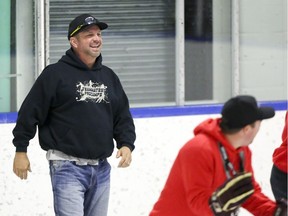 Country music legend Garth Brooks cheers on skaters in a relay as almost 60 nine to 13-year-old Bowness and Forest Lawn Heroes participants take in the Garth Brooks Ice Hockey ProCamp at Henry Viney Arena on Saturday, September 9, 2017 in Calgary, Alta. The Garth Brooks Teammates for Kids Foundation and ProCamps have helped provide scholarships for underprivileged children and free attendance to ProCamps Sports Camps for 13 years. Britton Ledingham/Postmedia Network

Handout Not For Resale
Britton Ledingham, Britton Ledingham/Postmedia Netw