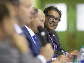 Mayor Naheed Nenshi smiles at a joke by opponent Bill Smith as seven mayoral candidates  including Dr. Emile Gabriel, David Tremblay, Bill Smith, David Lapp, Shawn Baldwin, Andre Chabot and Naheed Nenshi  meet at the Kerby Centre for the 55+ for a debate hosted by the Leadership Forum on Saturday, September 9, 2017 in Calgary, Alta. Nomination day is September 18, and election day is October 16. Britton Ledingham/Postmedia Network