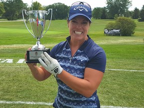 Calgary’s Lisa ‘Longball’ Vlooswyk shows off the hardware after winning the women’s division at the 2017 Canadian Long Drive Championship in Ontario.