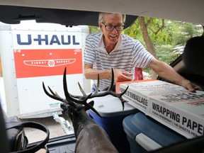 Waterton resident Tim Millar packs up valuables at his home on Thursday September 7, 2017. The town remained on alert for a possible evacuation with a large wildfire threatening the town. Millar had rented a U-Haul trailer and was heading to Calgary in advance of a possible mandatory evacuation order. Gavin Young/Postmedia