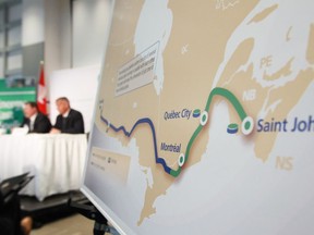 TransCanada President and Chief Executive Officer Russ Girling, right, and Trans Canada's President of Energy and Oil Pipelines Alex Pourbaix speak at their company's announcement of an Energy East Pipeline project on August 1, 2013.