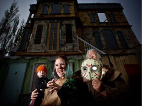 Ian Campbell and his daughter Christine pictured with her son Ryker Spickett, 1, at their haunted house in Calgary on Oct. 18, 2017. The family has been entertaining Calgarians with a haunted house for 26 years. Leah Hennel/Postmedia

POSTMEDIA CALGARY
Leah Hennel, Leah Hennel/Postmedia