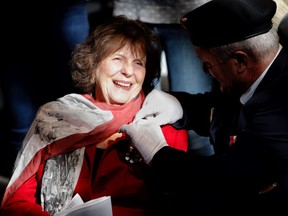 The Honorable Lois Mitchell, Lieutenant Governor of Alberta, receives the First Poppy during a ceremony at the military Museums in Calgary on Saturday October 21, 2017. Leah Hennel/Postmedia