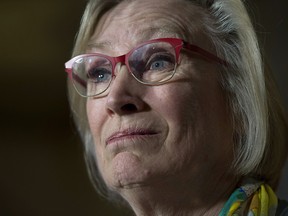 Crown-Indigenous Relations and Rorthern Affairs Minister Carolyn Bennett speaks during a news conference on Parliament Hill, in Ottawa on Oct. 6, 2017. Bennett announced a compensation package for indigenous victims of the '60s Scoop.