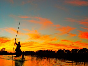 Travelling by canoe in Botswana.