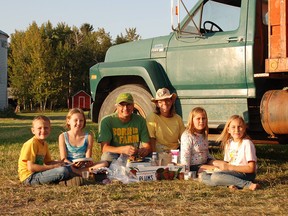 Roger and Bonita Bott with their four children, Caleb, Catie and the twins, Dara and Jana. The three daughters
were fatally smothered by canola seed while playing on a transport truck on the family farm near Withrow, Alta., on Oct. 13, 2015.
