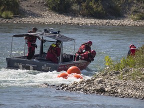 File photo of Calgary Fire Rescue crew working on the Bow River.