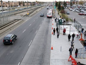 Commuters wait at an under construction bus stop at the Rundle CTrain station in Calgary on Tuesday October 10, 2017.