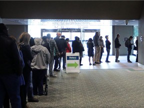 The line up to vote at the City Hall polling station stretched around the atrium as Calgarian waited to cast their ballots in the municipal election on Monday October 16, 2017.  Gavin Young/Postmedia

Postmedia Calgary
Gavin Young, Calgary Herald