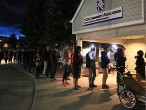 Several hundred Ward 6 Calgarians remained in line outside the Strathcona Community Centre waiting to vote at 8 pm on municipal election day Monday October 16, 2017.