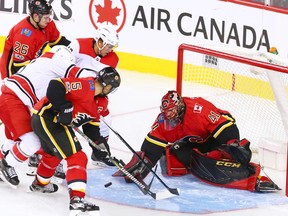 The Calgary Flames' Mike Smith stops this Carolina Hurricanes scoring chance during 3rd period NHL action at the Scotiabank Saddledome in Calgary on Thursday October 19, 2017.