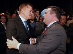 Jason Kenney, right, shakes hands with Brian Jean after it was announced Kenney was elected leader of the United Conservative Party.