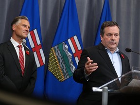 Calgary Lougheed MLA Dave Rodney listens to Jason Kenney after Rodney announced that he would give up his seat to make way for a by-election to elect new UCP leader Kenney. The two made the announcement at the downtown Calgary Hyatt hotel on Sunday October 29, 2017.