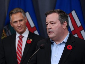 Calgary Lougheed MLA Dave Rodney listens to Jason Kenney after Rodney announced that he would give up his seat to make way for a by-election to elect new UCP leader Kenney. The two made the announcement at the downtown Calgary Hyatt hotel on Sunday October 29, 2017.
