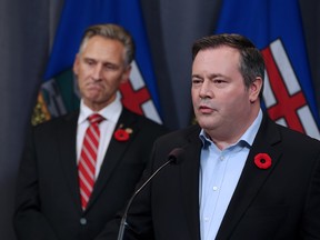 Calgary Lougheed MLA Dave Rodney listens to Jason Kenney after Rodney announced that he would give up his seat to make way for a by-election to elect new UCP leader Kenney. The two made the announcement at the downtown Calgary Hyatt hotel on Sunday October 29, 2017.