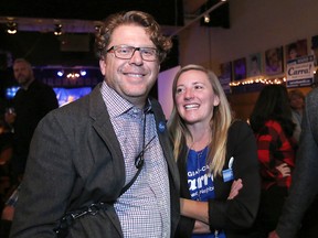 Ward 9 incumbent councillor Gian-Carlo Carra and his wife Barb watch results roll in with supporters at the Ironwood Stage & Grill on Monday, Oct. 16, 2017.