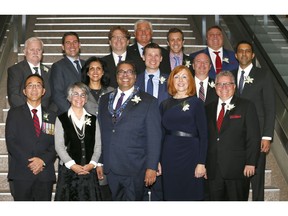 Members of Calgary's new council pose for a photo after the Council Swearing-In Ceremony at the Calgary Municipal Building on Monday October 23, 2017.