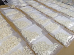 Police display the 1.5 kilograms of crack cocaine seized in Lethbridge, packaged for street sale