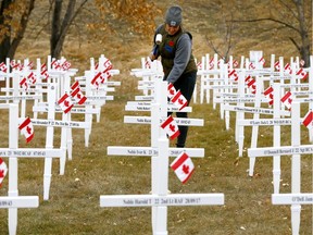 Marney Steadman was among 300 volunteers who came out to set up The Field of Crosses along Memorial Drive in Calgary on Saturday.