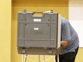 A Calgarian votes at Briar Hill Elementary School,  in the northwest, during Monday's civic election.