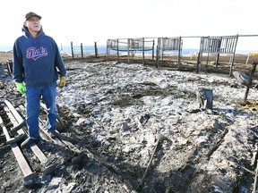 Marlon Many Guns shows what remains of his barn in Gleichen, Alberta south of Calgary.Wednesday, October 18, 2017.A wildfire raced through the reserve on Tuesday night, destroying, property and animals were burned alive. Jim Wells/Postmedia