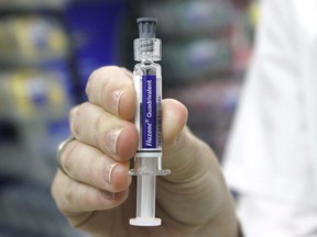 London Drugs Pharmacist Agusha McGrath displays a portion of a flu kit in southwest Calgary Friday, October 20, 2017. Jim Wells/Postmedia