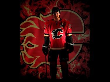 Calgary Flames Sean Monahan during player introductions before facing the Winnipeg Jets in the teams home opener in NHL hockey at the Scotiabank Saddledome in Calgary on Saturday, October 7, 2017. Al Charest/Postmedia