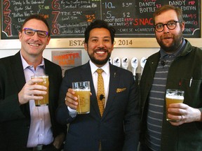 (L to R) Terry Rock, executive director, Alberta Small Brewers Association, Ricardo Miranda, Minister of Culture and Tourism and Ben Leon, Managing Director of The Dandy Brewing Company pose for a photo after the Alberta government announced new funding for craft brewers.  Wednesday, October 25, 2017. Dean Pilling/Postmedia
