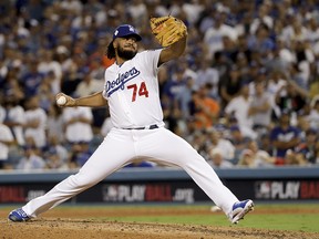 Los Angeles Dodgers relief pitcher Kenley Jansen throws against the Houston Astros during the eighth inning of Game 2 of baseball's World Series Wednesday, Oct. 25, 2017, in Los Angeles.