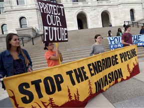 Tribal and environmental groups opposed to the proposed Enbridge Line 3 project rally Thursday, Sept. 28, 2017 at the State Capitol in St. Paul, Minn. to express concerns about the project's risks to Minnesota's clean water, wildlife and tar sands oil's contribution to global climate change.