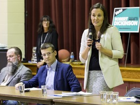 Ward 11 candidate Jafnet Eremenko responds to a question during a forum at Nellie McClung school. Also at the table, from left, are candidates Keith Simmons and Jeromy Farkas.