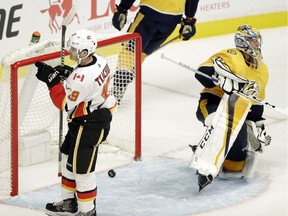 Pekka Rinne, Matthew Tkachuk

Calgary Flames left wing Matthew Tkachuk (19) celebrates after scoring a goal against Nashville Predators goalie Pekka Rinne (35), of Finland, in the third period of an NHL hockey game Tuesday, Oct. 24, 2017, in Nashville, Tenn. Tkachuk later scored the winning goal in a shootout as the Flames won 3-2. (AP Photo/Mark Humphrey) ORG XMIT: TNMH121
Mark Humphrey, AP