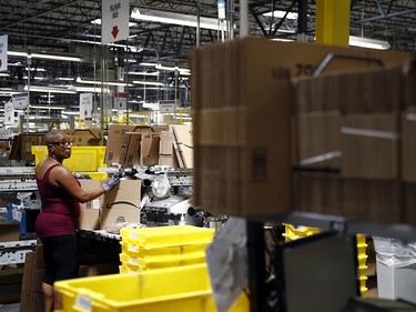 Cynthia Richburg prepares a product for shipment at an Amazon fulfillment centre in Baltimore.