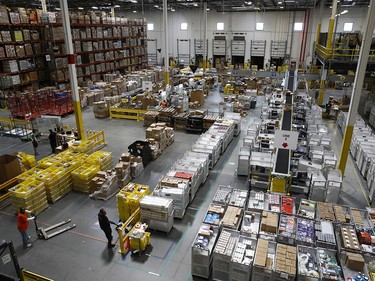 Workers prepare to move products at an Amazon fulfillment centre in Baltimore.
