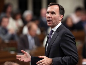 Finance Minister Bill Morneau stands up during Question Period in the House of Commons in Ottawa, Tuesday, October 3, 2017. THE CANADIAN PRESS/Fred Chartrand