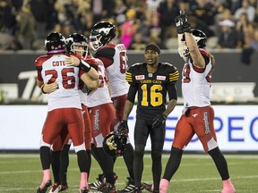Hamilton Tiger-Cats wide receiver Brandon Banks walks away in defeat as the Calgary Stampeders celebrate their game-winning field goal in Hamilton on Oct. 13, 2017.