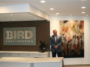 Ian Reid, vice-president and Calgary district manager of Bird Construction, stands in the lobby of the company's new Calgary offices.