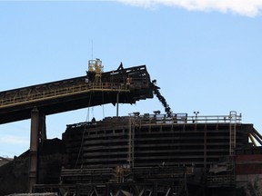 A hopper unloads at Suncor's Millenium Mine north of Fort McMurray, Alta. on Wednesday September 27, 2017.