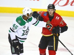 Stars Gemel Smith (L) tangles with Flames Mark Jankowski during NHL game action between the Dallas Stars and the Calgary Flames in Calgary on Friday, October 27, 2017. Jim Wells/Postmedia