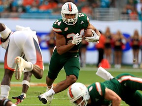 Travis Homer #24 of the Miami Hurricanes rushes during a game against the Syracuse Orange at Sun Life Stadium on October 21, 2017 in Miami Gardens, Florida.