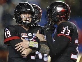 Calgary Stampeders quarterback Bo Levi Mitchell, left, during their game against the Saskatchewan Roughriders in CFL action at McMahon Stadium in Calgary, Alta.. on Friday October 20, 2017.