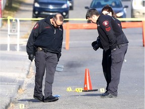Calgary police investigate a shooting on the 4600 block of Bowness Rd. N.W. which sent a man to hospital were he died of his injuries on Saturday October 14, 2017. 
Postmedia Calgary
Darren Makowichuk, DARREN MAKOWICHUK/Postmedia